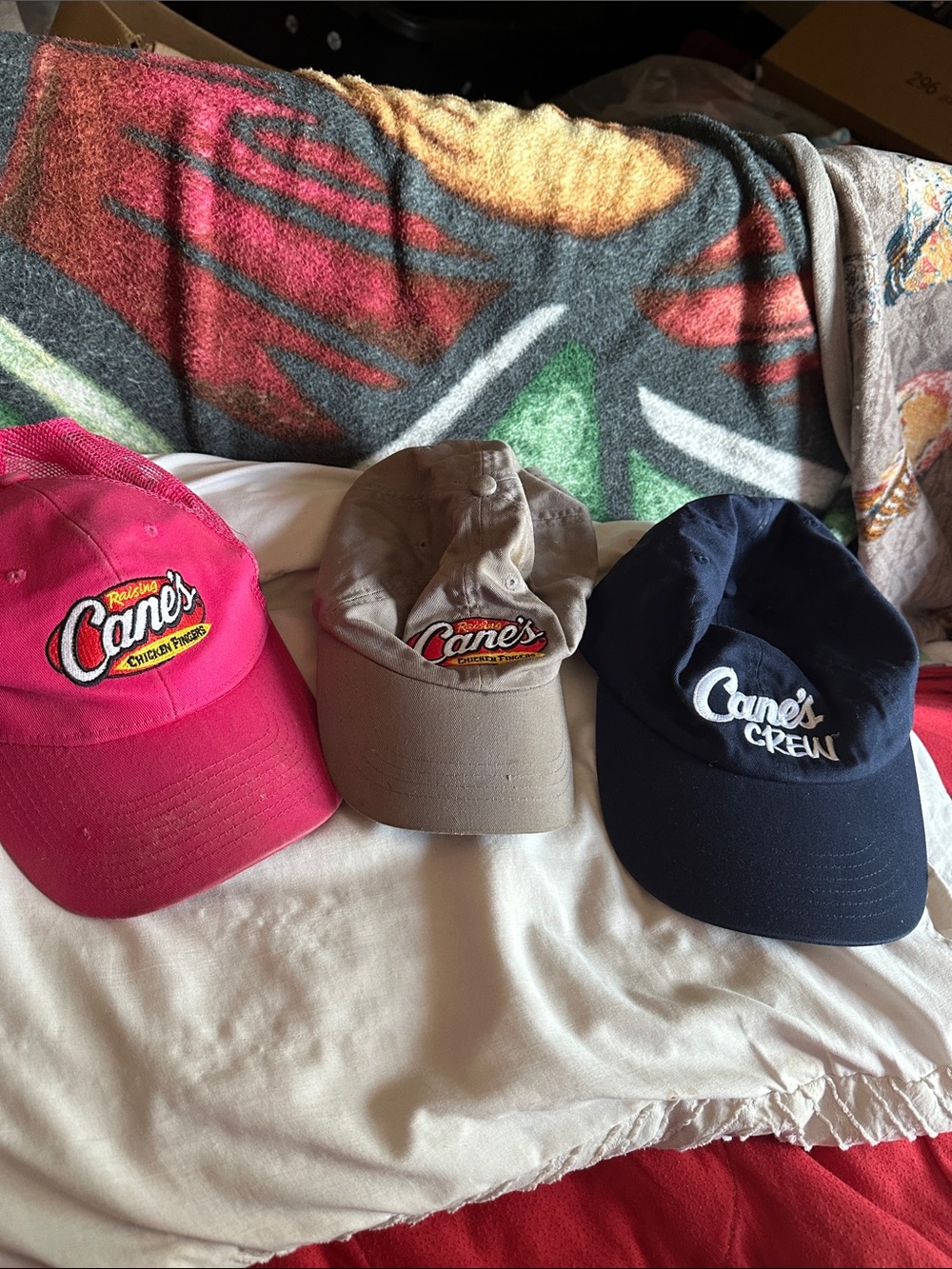 Official raising Cane‘s crew Hats in Navy, Tan, Pink